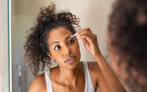 Close-up of freshly treated brows appearing darker with slight redness and swelling