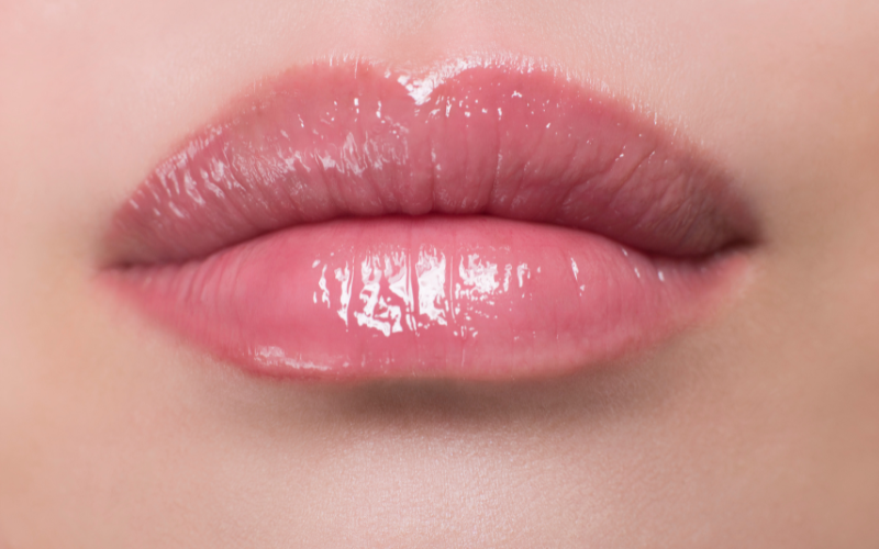 Healed results of a lip tattoo showing smooth, naturally tinted lips with a glossy finish