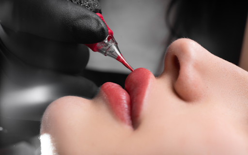 Close-up of freshly tattooed lips with slight swelling
