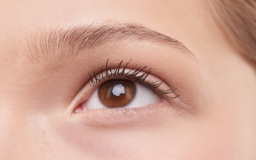 Close-up of microbladed brows with fine, hair-like strokes for a natural look